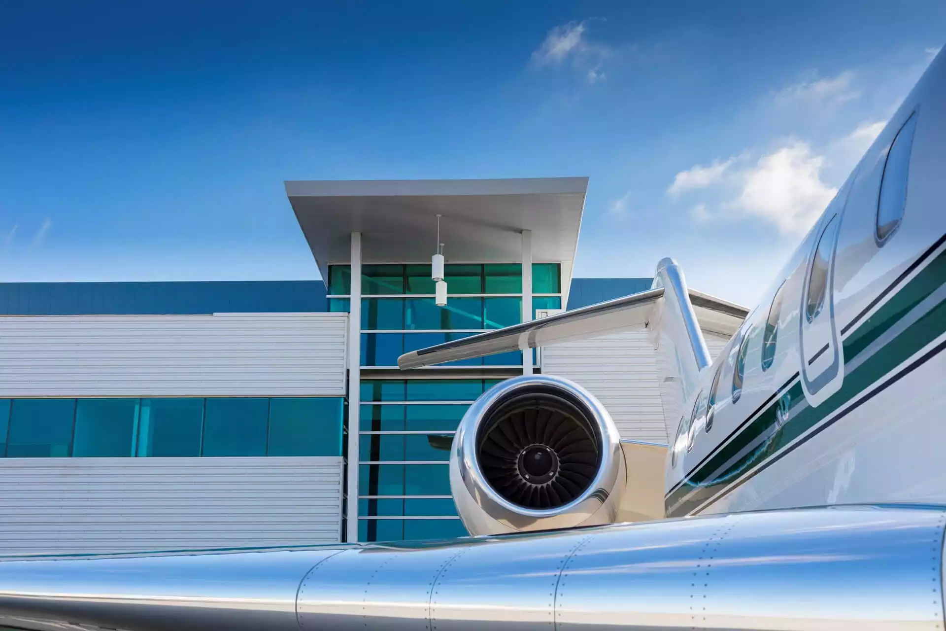 Private Jet in front of modern building
