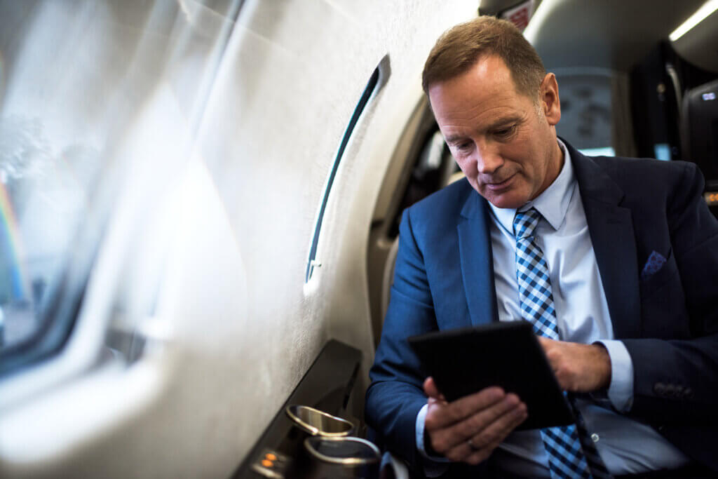 passenger in suit - charter a business jet