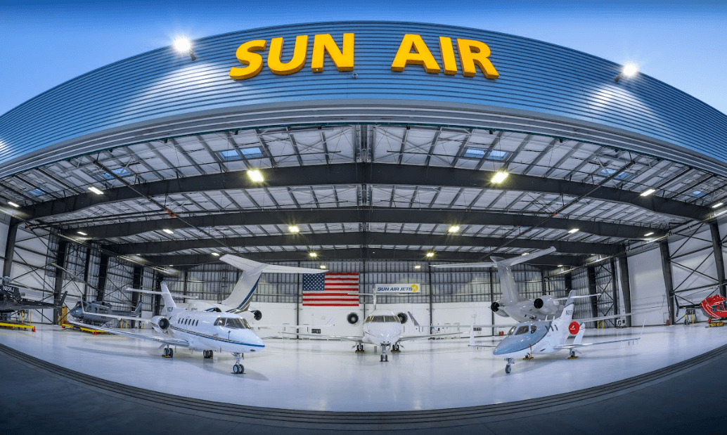 Sun Air Jets hanger with various private jet sizes for charter