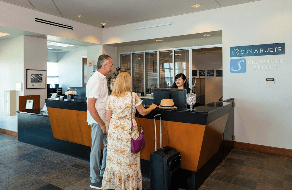 couple at Sun Air Jets asking "what are empty leg flights?"