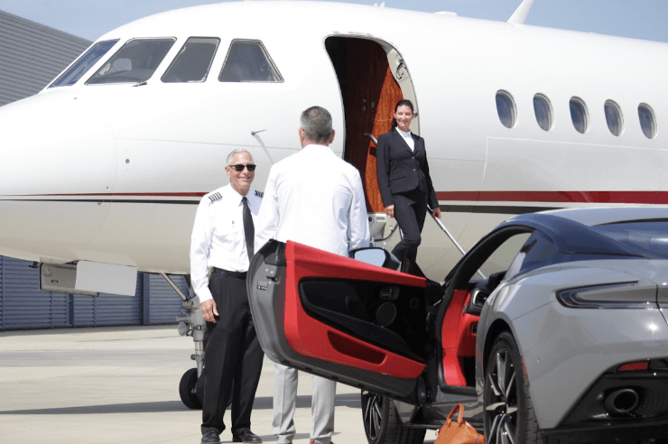 business professional arriving at private jet for corporate jet travel