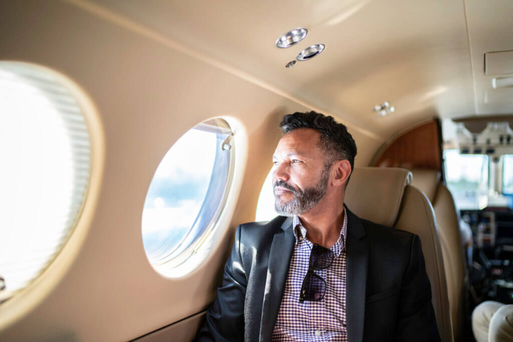 man on private jet after asking how far can a private jet fly